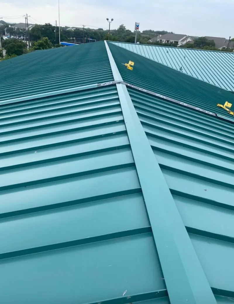 Green commercial metal roof ridge and valley for Metal Roof Repair in Monfort Heights